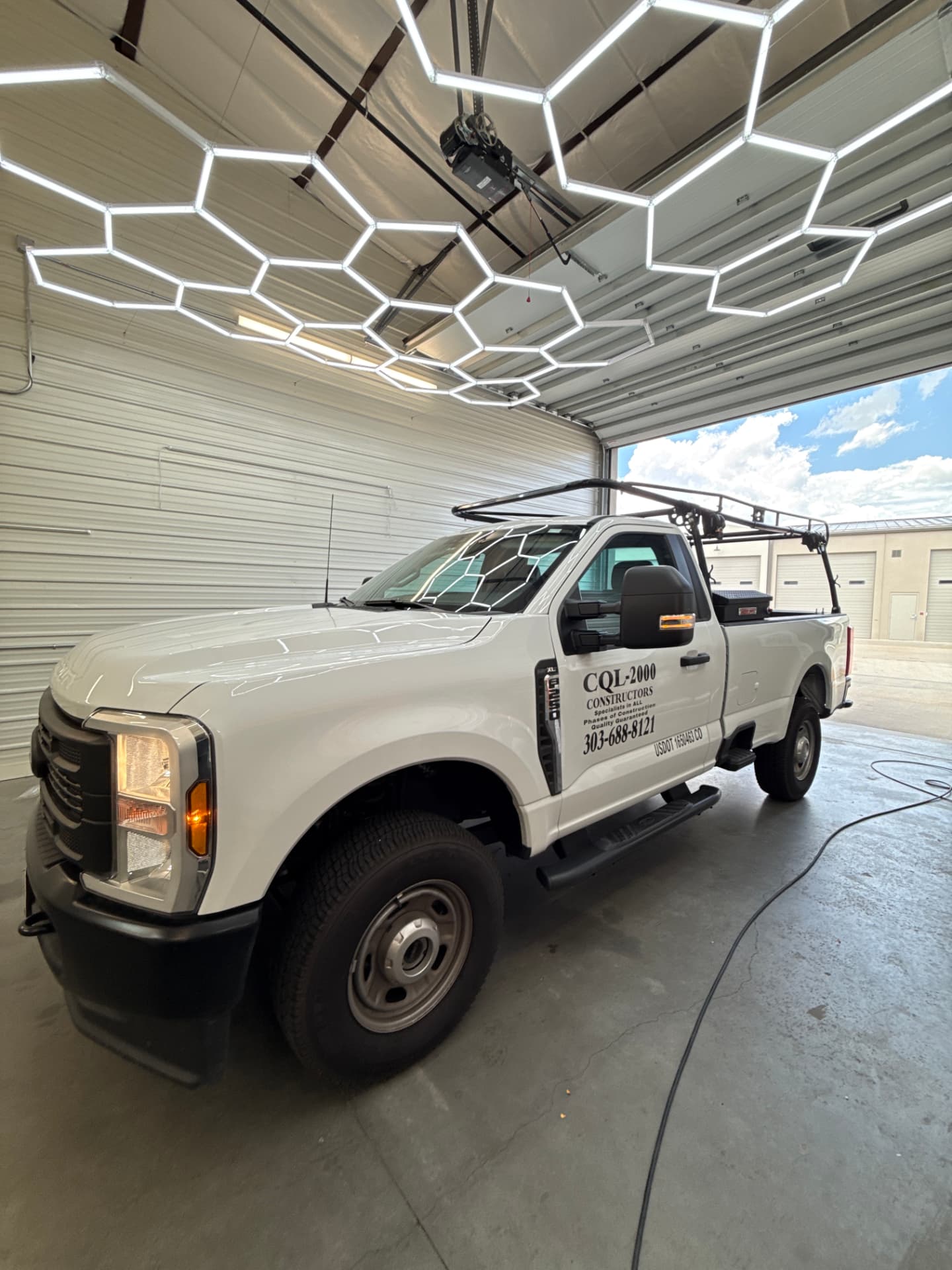 White Ford Super Duty work truck with ceramic tint in the Hypershade install bay